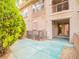 Inviting backyard patio featuring a covered area and mature trees, great for entertaining at 10051 Sand Key St, Las Vegas, NV 89178