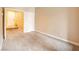 Bright and spacious bedroom with neutral carpet, white trim, and ample space to add furniture at 10051 Sand Key St, Las Vegas, NV 89178
