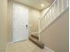 The entryway features tile flooring with a staircase leading to the upper level of the home at 10051 Sand Key St, Las Vegas, NV 89178