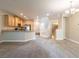 This open kitchen flows into the living space, stainless steel appliances, and light cabinetry at 10051 Sand Key St, Las Vegas, NV 89178
