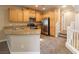 This kitchen features light wood cabinets, stainless steel appliances, and granite countertops at 10051 Sand Key St, Las Vegas, NV 89178