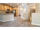 Open kitchen features stainless steel appliances, granite countertops, and light-colored cabinets at 10051 Sand Key St, Las Vegas, NV 89178