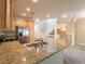 This kitchen features light wood cabinets, stainless steel appliances, and granite countertops at 10051 Sand Key St, Las Vegas, NV 89178