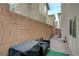 Long pavers with green artificial turf creates a relaxing outside atmosphere at 10722 Red Badge Ave, Las Vegas, NV 89166