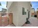 Exterior view of a cozy backyard featuring brick pavers and access to a gated walkway at 10722 Red Badge Ave, Las Vegas, NV 89166