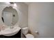 Cozy half bath with a modern vessel sink and light-toned walls at 10722 Red Badge Ave, Las Vegas, NV 89166