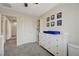 A lovely bedroom boasts a white dresser, sports decor, and a view of the hall at 10722 Red Badge Ave, Las Vegas, NV 89166