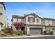 Inviting two-story house with a two-car garage, desert landscaping, and a welcoming front entrance at 10722 Red Badge Ave, Las Vegas, NV 89166