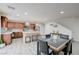 Spacious kitchen with a large island, eat-in dining area, and modern lighting at 10722 Red Badge Ave, Las Vegas, NV 89166