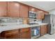 Modern kitchen features stainless steel appliances and updated cabinetry at 10722 Red Badge Ave, Las Vegas, NV 89166