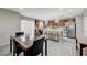 Open concept kitchen and dining area with tile floors and modern fixtures at 10722 Red Badge Ave, Las Vegas, NV 89166