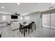 Bright living room with tile floors, a ceiling fan, and sliding glass doors at 10722 Red Badge Ave, Las Vegas, NV 89166