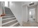 Carpeted staircase leading to an upper level with a view into a bedroom at 10722 Red Badge Ave, Las Vegas, NV 89166