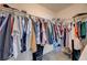 Walk-in closet with built-in shelving and hanging racks at 10722 Red Badge Ave, Las Vegas, NV 89166