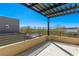 Outdoor balcony with a pergola, metal railing, and desert views, perfect for relaxation at 10879 Artesano Ave, Las Vegas, NV 89135