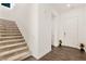 Entryway featuring stairs, tiled flooring, and neutral walls with white doors at 10879 Artesano Ave, Las Vegas, NV 89135