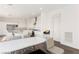 Bright kitchen with a granite island and breakfast bar area, plus stainless appliances and white cabinets at 10879 Artesano Ave, Las Vegas, NV 89135