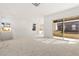 Expansive living room area with large windows and balcony access providing ample natural light at 10879 Artesano Ave, Las Vegas, NV 89135