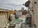 Backyard patio featuring outdoor seating and a barbecue grill, with a view of the Las Vegas skyline at 110 Palm Ln, Las Vegas, NV 89101