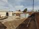 Spacious backyard with shed, mature trees, and fenced perimeter at 110 Palm Ln, Las Vegas, NV 89101
