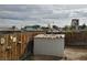 Backyard of home, featuring a shed with tools and a view of the Las Vegas skyline beyond the fence at 110 Palm Ln, Las Vegas, NV 89101