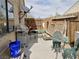 Outdoor patio area with grill, table, and seating next to a house with a window at 110 Palm Ln, Las Vegas, NV 89101