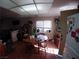 Dining area with wood table set, bright lighting and interior plants at 110 Palm Ln, Las Vegas, NV 89101