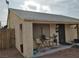 Home featuring a quaint covered front porch and desert landscaping in the front yard at 110 Palm Ln, Las Vegas, NV 89101