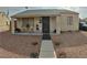 Charming single-story home featuring desert landscaping and a cozy covered porch entry at 110 Palm Ln, Las Vegas, NV 89101