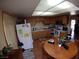 Kitchen features wood cabinets, tile floors, and bright natural light at 110 Palm Ln, Las Vegas, NV 89101