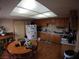 Cozy kitchen featuring wood cabinets and a view to an adjacent dining area at 110 Palm Ln, Las Vegas, NV 89101