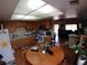 Open kitchen featuring wood cabinetry and adjacent dining area at 110 Palm Ln, Las Vegas, NV 89101