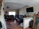 Open concept living room with TV, leather sofas, and bar seating at 110 Palm Ln, Las Vegas, NV 89101