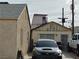 Street view with a partial view of the Circa hotel over the rooftops of neighborhood homes at 110 Palm Ln, Las Vegas, NV 89101