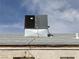 Close-up of the roof featuring an air conditioning unit and a gray shingle roof at 110 Palm Ln, Las Vegas, NV 89101