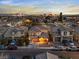 Well-situated home with balcony, porch, and a skyline view; surrounded by neighborhood residences at 1309 Rainy Sky Ave, North Las Vegas, NV 89030
