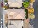 Aerial view of a home with a landscaped backyard and a tiled roof in a residential neighborhood at 1309 Rainy Sky Ave, North Las Vegas, NV 89030