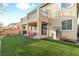 Enjoy this backyard with its plush artificial turf and covered patio at 1309 Rainy Sky Ave, North Las Vegas, NV 89030