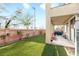 Beautiful backyard with synthetic grass offers outdoor living space at 1309 Rainy Sky Ave, North Las Vegas, NV 89030
