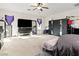 Bedroom with ceiling fan, carpeted floors, ample closet space and abundant natural light at 1309 Rainy Sky Ave, North Las Vegas, NV 89030