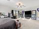 Large bedroom with ceiling fan, carpeted floors, a lot of natural light and neutral walls at 1309 Rainy Sky Ave, North Las Vegas, NV 89030