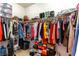 Walk-in closet with ample storage, hanging rods, and shelving for organization at 1309 Rainy Sky Ave, North Las Vegas, NV 89030