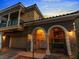 Close-up of a beautiful two-story home with stone accents and a covered porch at 1309 Rainy Sky Ave, North Las Vegas, NV 89030
