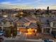 Well-kept two-story home with a balcony and covered front porch against the city skyline at 1309 Rainy Sky Ave, North Las Vegas, NV 89030
