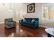 Bright living room featuring hardwood floors, neutral walls and modern decor at 1309 Rainy Sky Ave, North Las Vegas, NV 89030