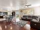 Cozy living area with hardwood floors, open to a dining area and kitchen, and lots of natural light at 1309 Rainy Sky Ave, North Las Vegas, NV 89030