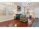 Comfortable living area featuring hardwood floors, neutral walls and modern decor at 1309 Rainy Sky Ave, North Las Vegas, NV 89030