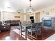 Spacious living room featuring hardwood floors, a fireplace and comfortable seating at 1309 Rainy Sky Ave, North Las Vegas, NV 89030