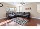 Cozy living area featuring hardwood floors, a rug, and comfortable seating at 1309 Rainy Sky Ave, North Las Vegas, NV 89030