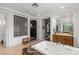 Bright bathroom featuring a marble-clad tub and an elegant shower at 2001 Alcova Ridge Dr, Las Vegas, NV 89135